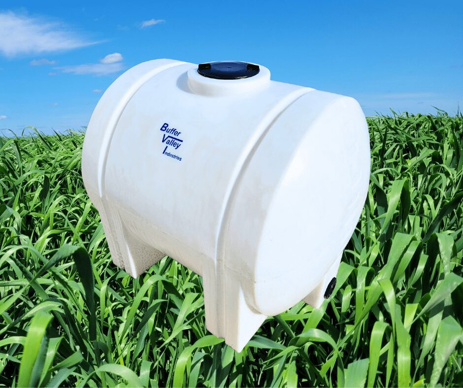 225 US gallon liquid handling tank with grass and sky background